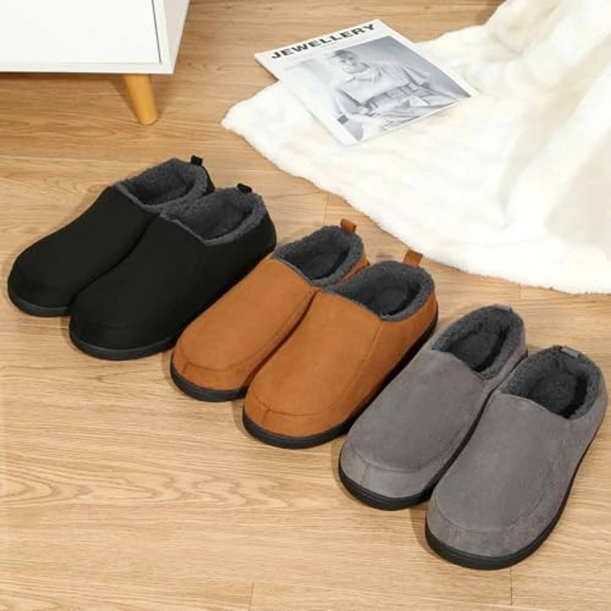 Set of indoor slip-on slippers in black, tan, and grey with plush lining and rubber soles