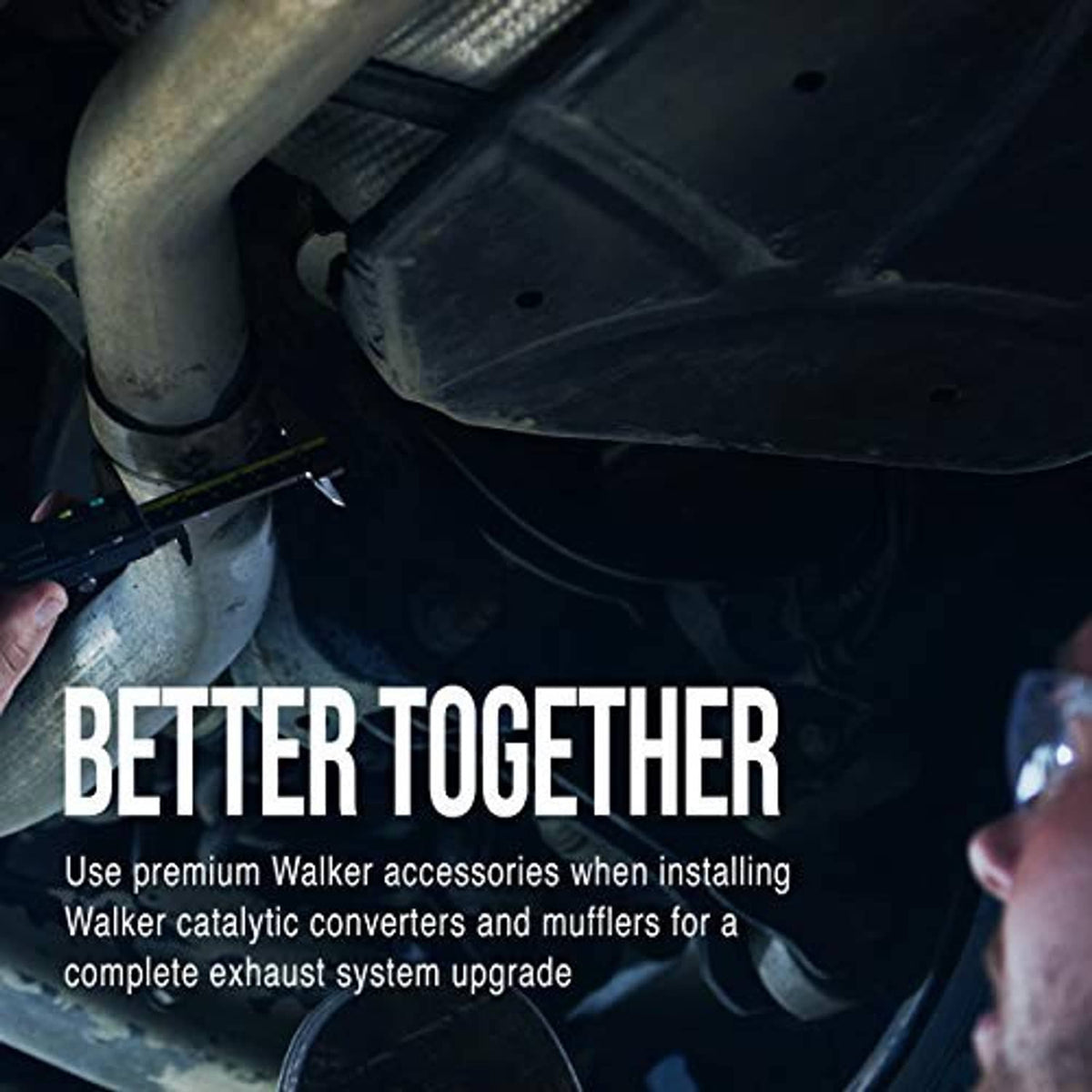 Black rubber exhaust hanger insulator installed under vehicle near exhaust pipe
