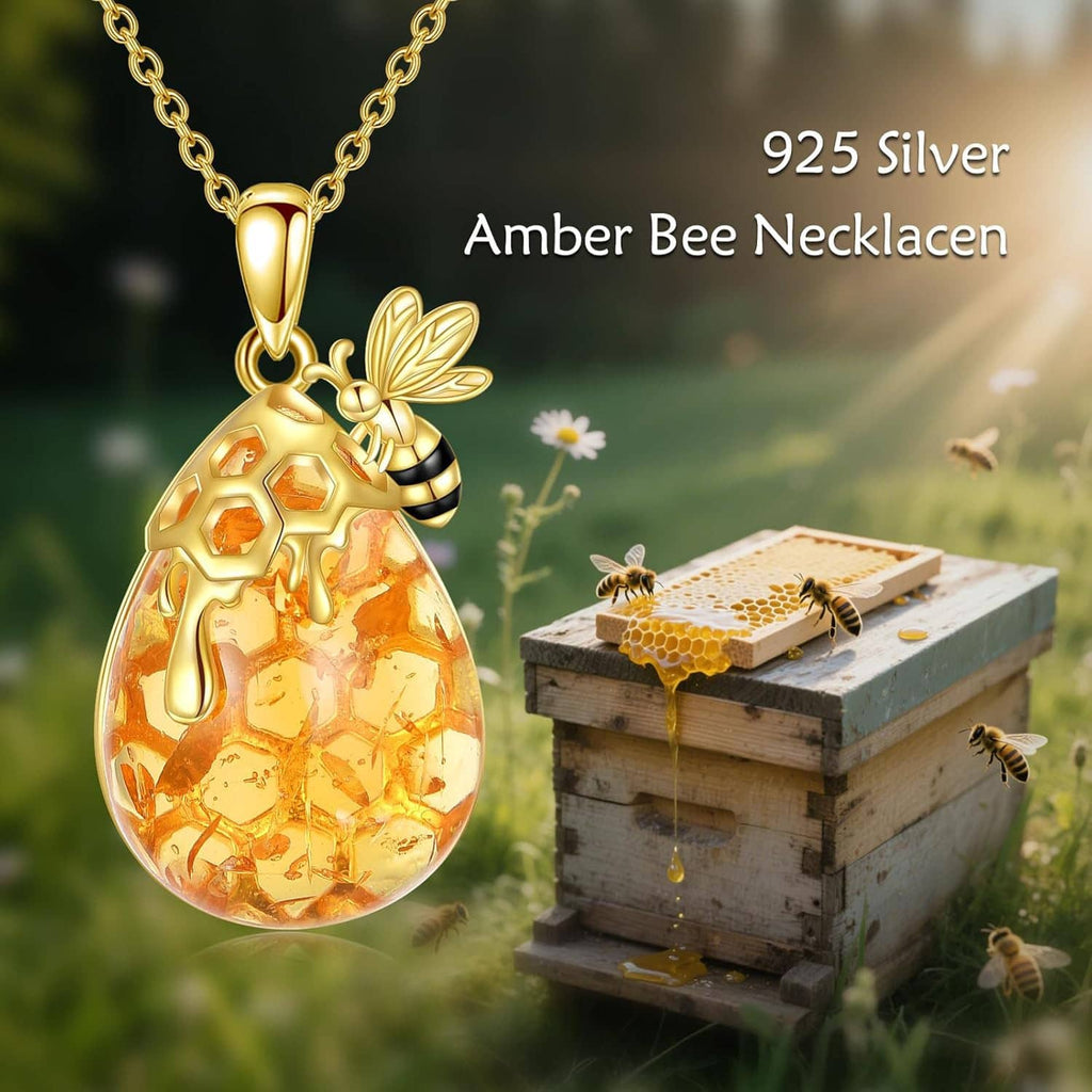 Gold bee amber teardrop pendant necklace with gold-tone chain and bee details