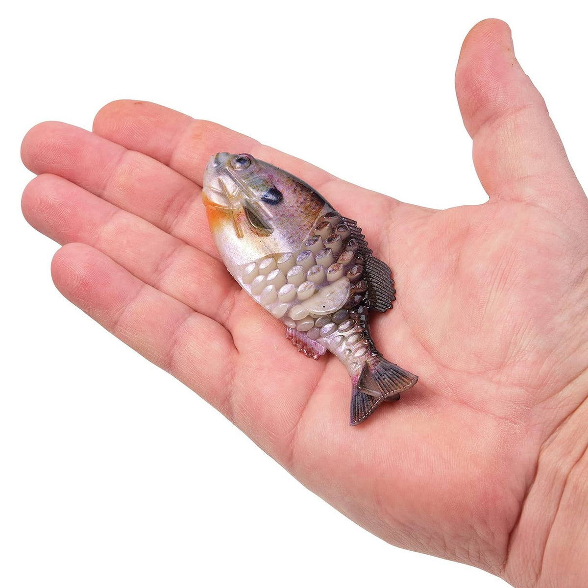 Berkley PowerBait Gilly soft fishing bait held in hand, bluegill pattern