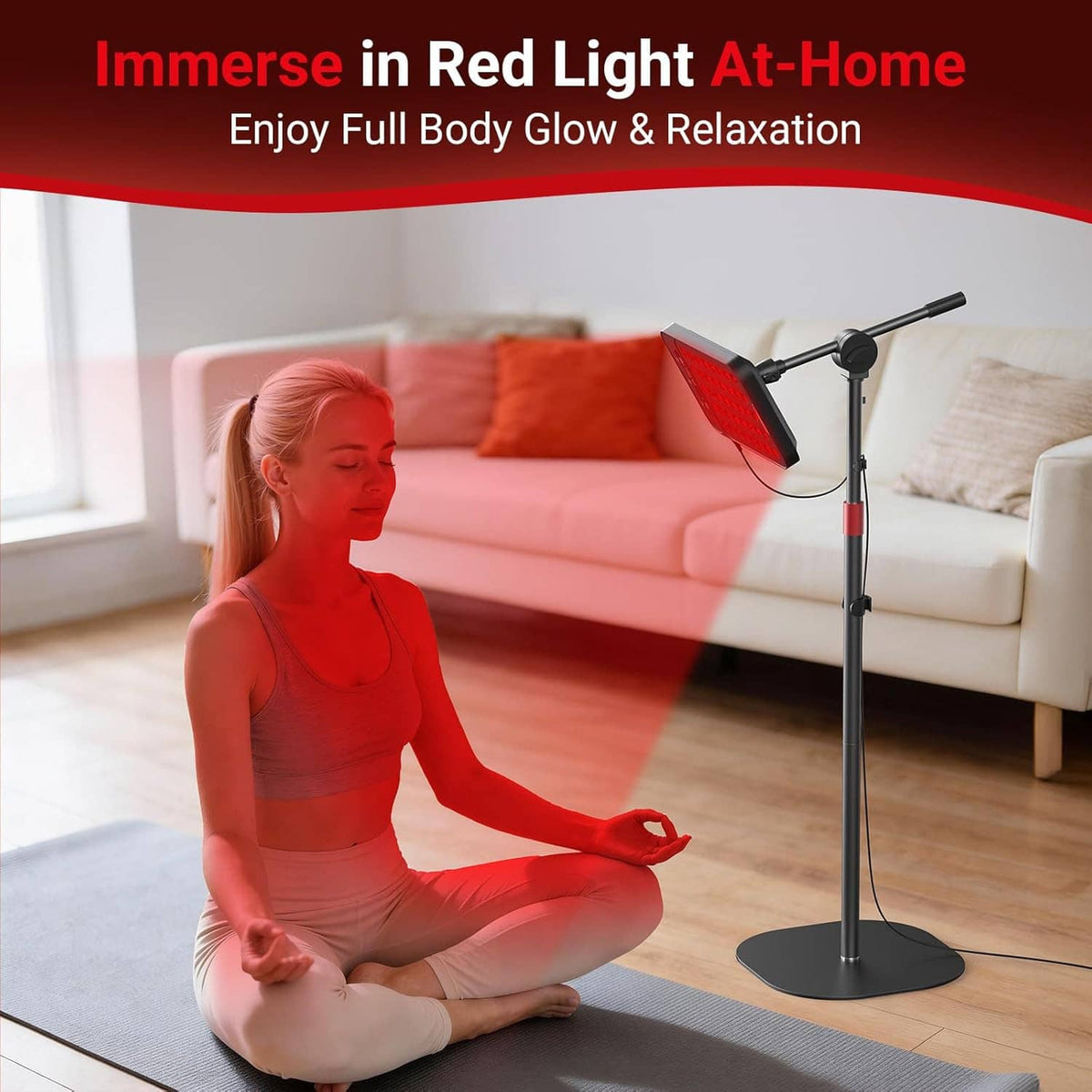 Red light therapy lamp on floor stand used during at-home seated session