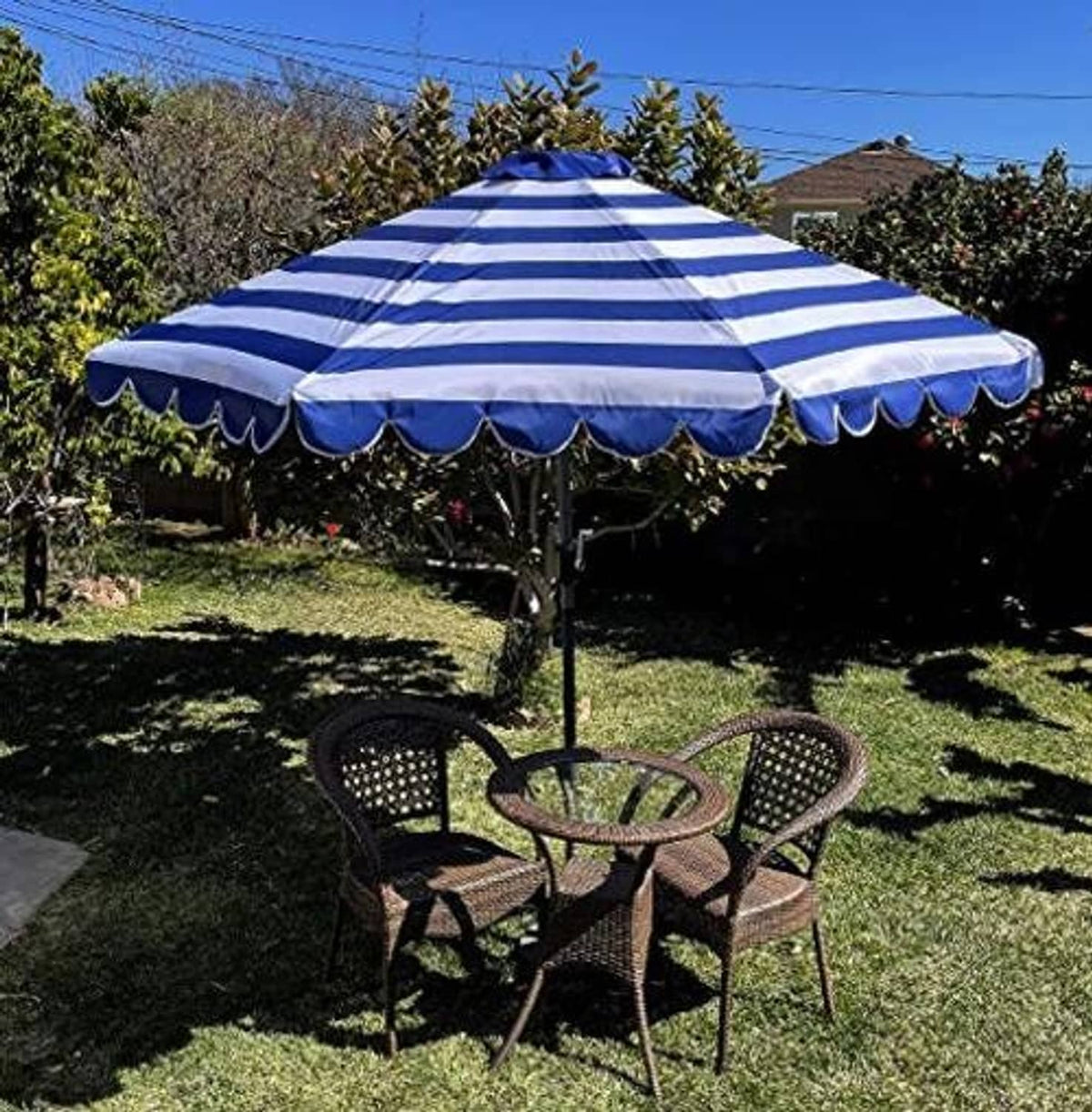 Top view of royal and white striped umbrella canopy replacement with scalloped front edge