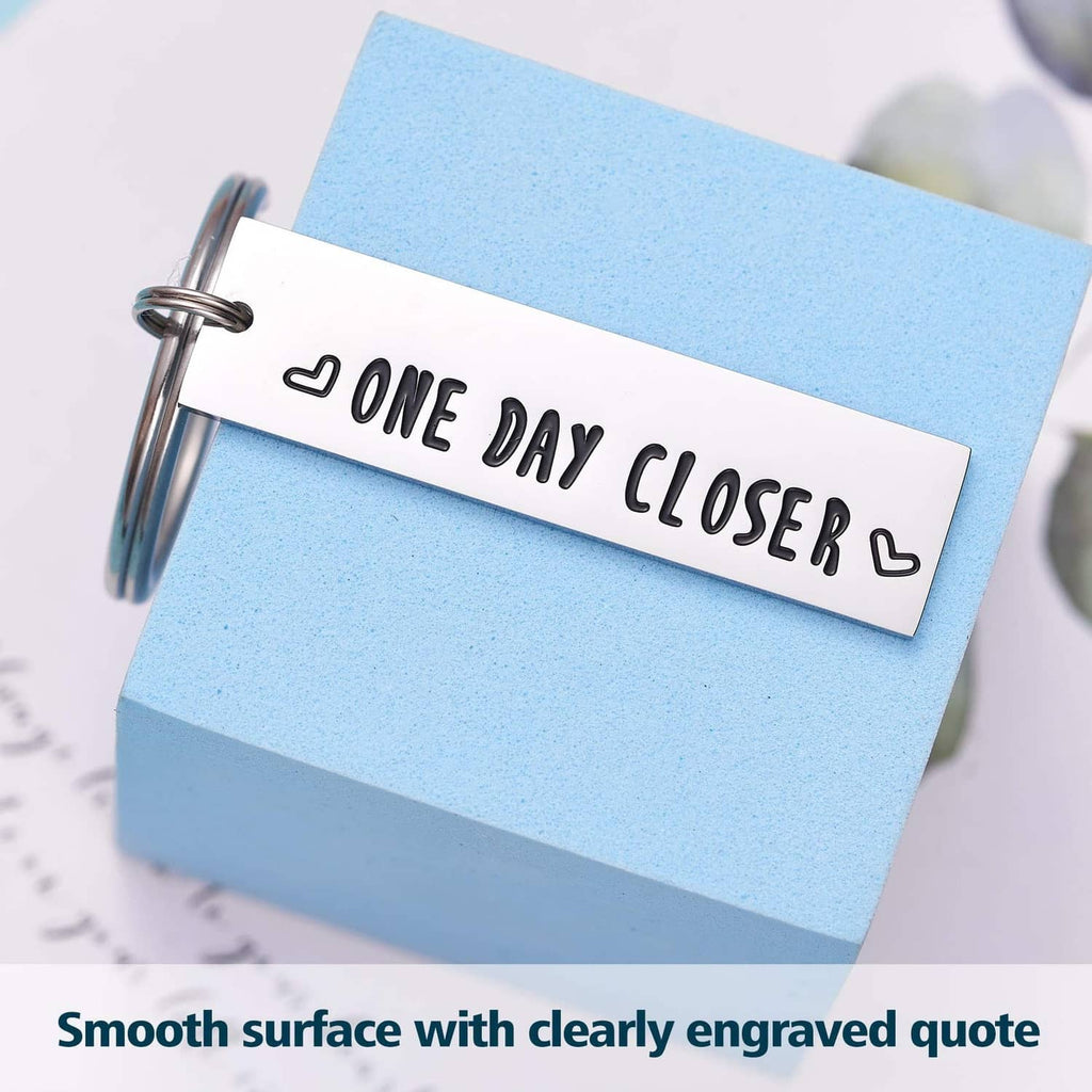 Stainless steel keychain with smooth engraved 'ONE DAY CLOSER' lettering