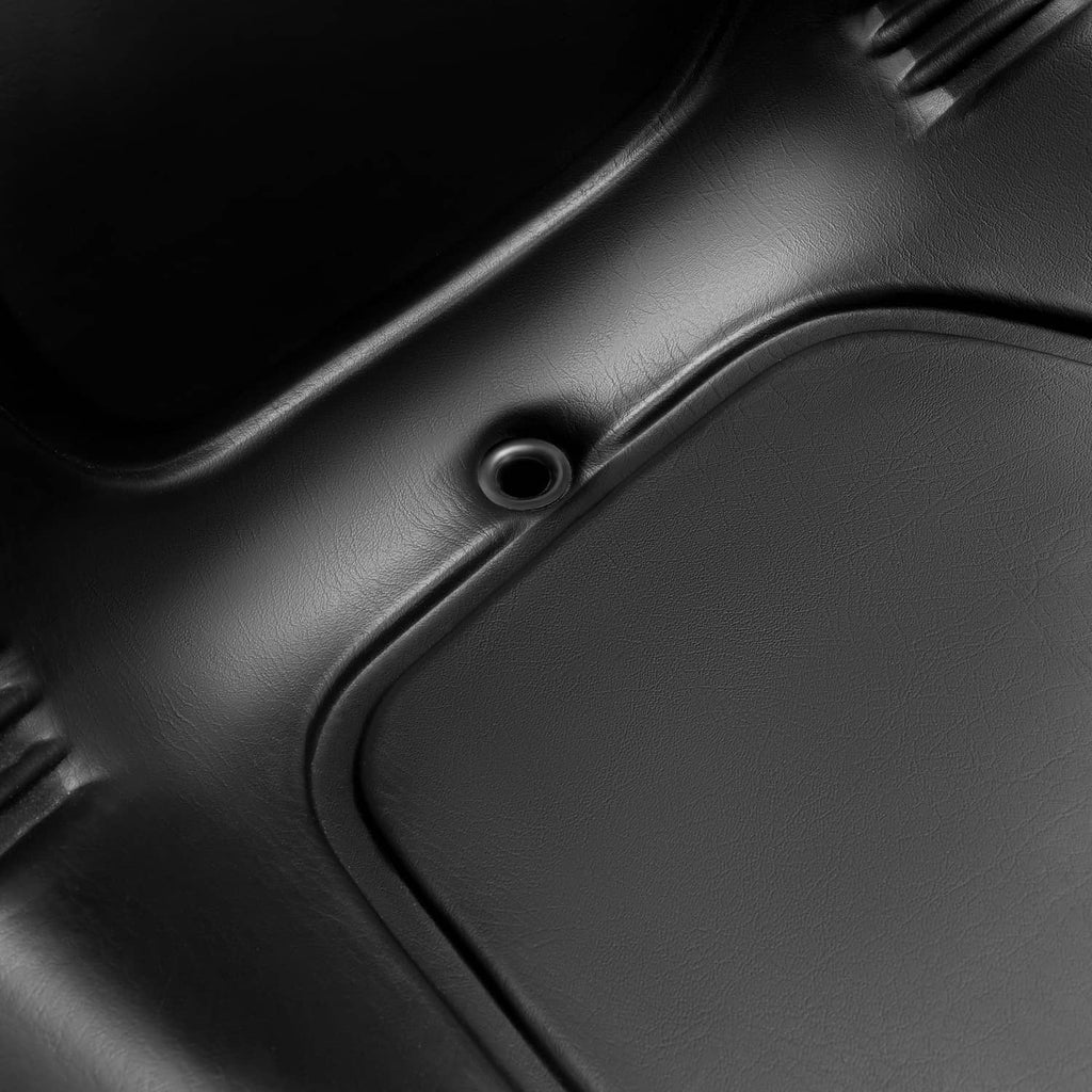 Close-up of black seat surface texture with circular fastener hole detail