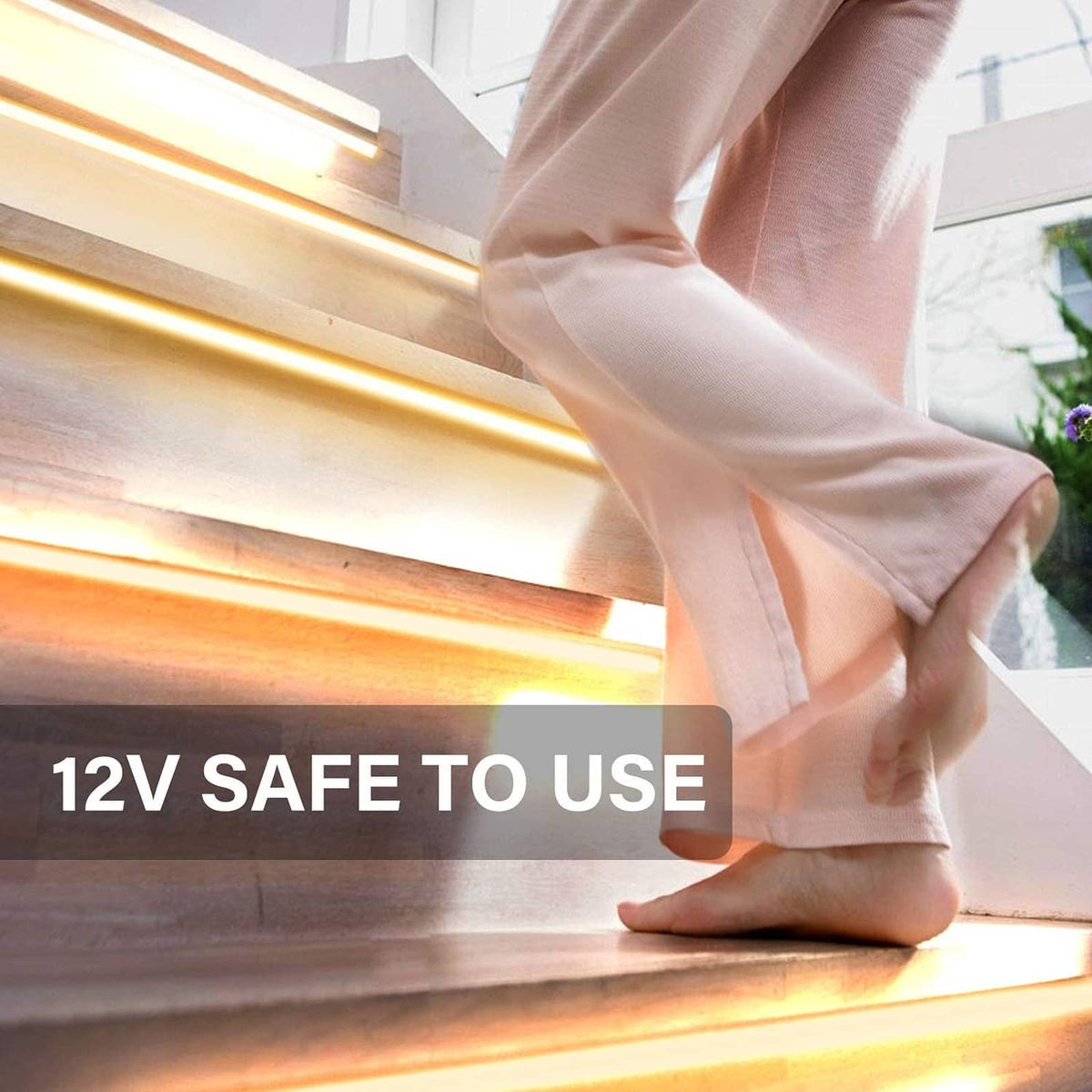 Warm white LED strip light along a wall edge with soft glow near the floor