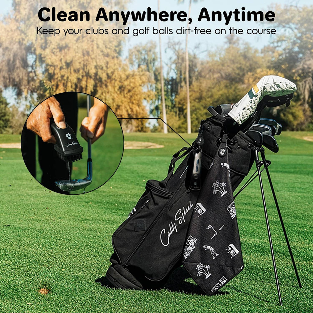 Black golf club brush cleaner with water flow, held against a golf club