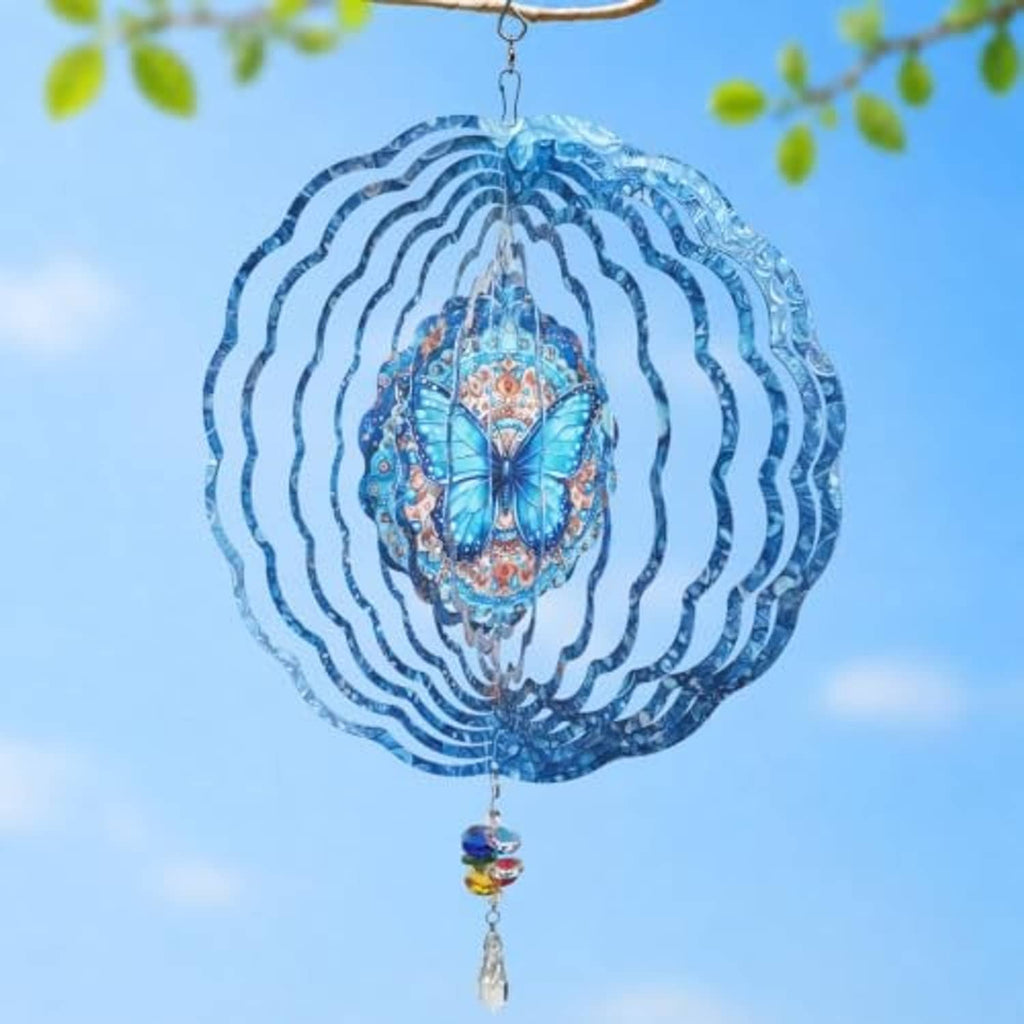 Blue butterfly wind spinner showing layered wavy rings and rainbow crystal charm
