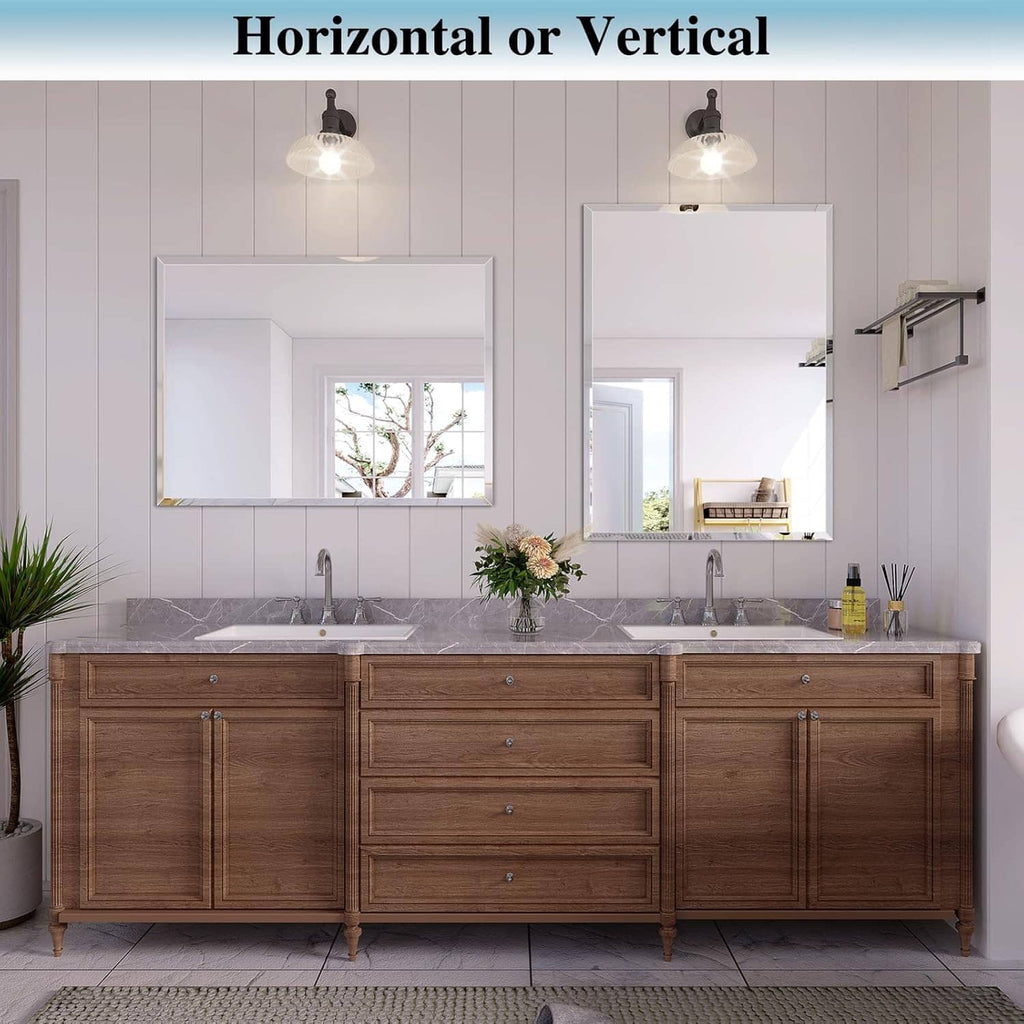 Frameless rectangular bathroom mirror with beveled edge above long vanity cabinet