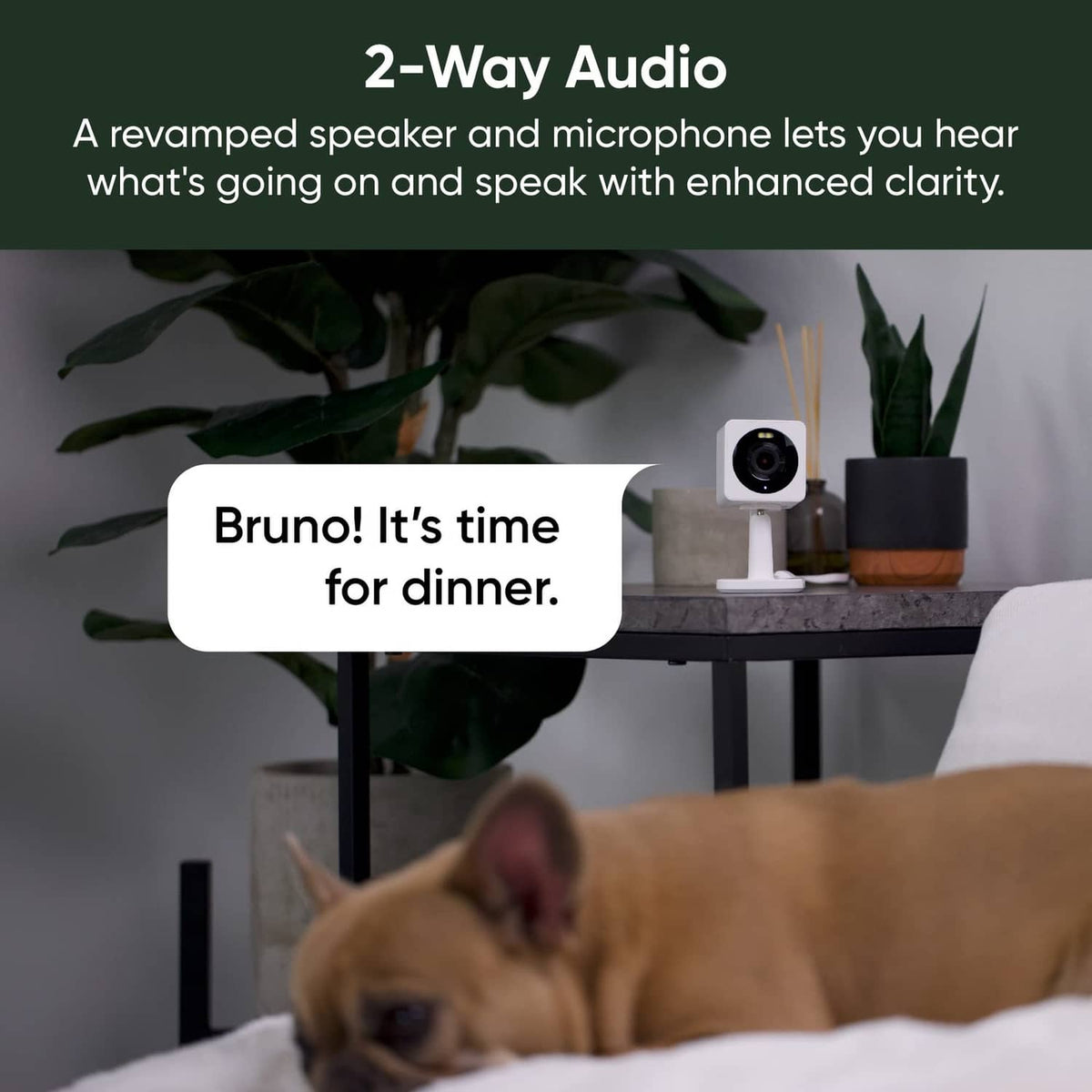 White security camera on a stand with lens facing forward in a living room