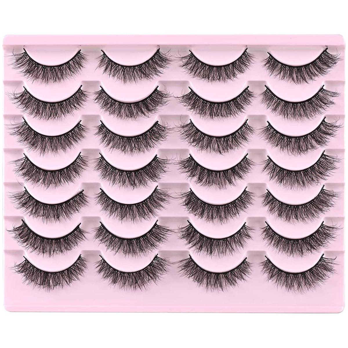 Multiple pairs of natural short wispy false mink lashes arranged on pink tray