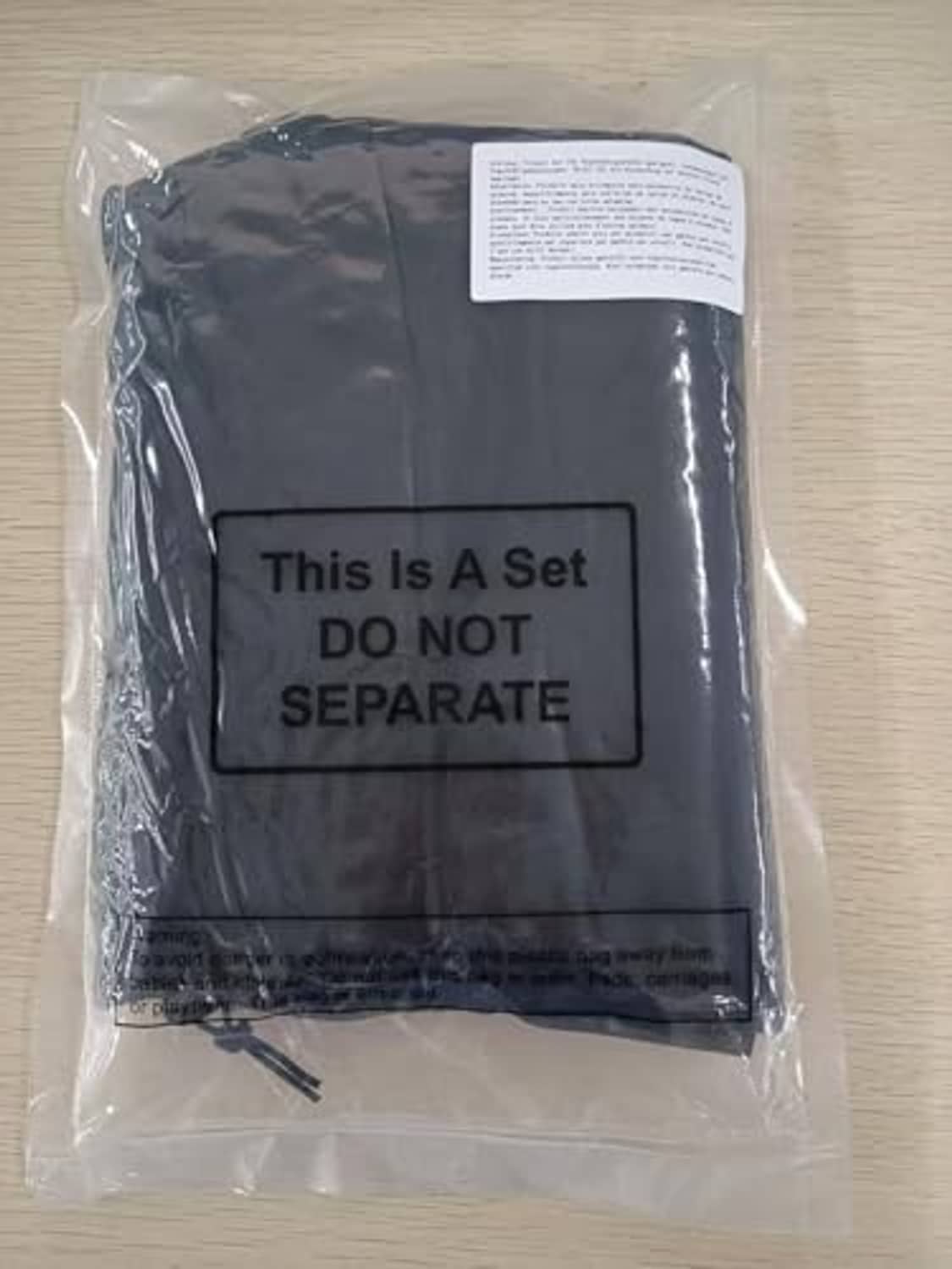 Black birdcage cover net packed in a sealed plastic bag for storage or shipping