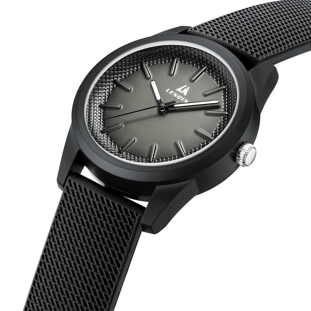 Black men's wristwatch with textured strap, silver bezel ring, round dial with baton markers.