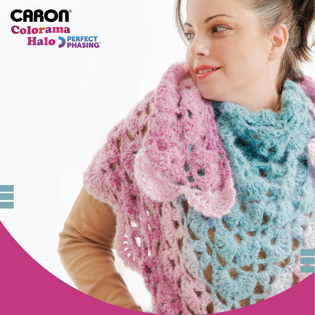 Two-tone fuzzy knit infinity scarf in pink and light blue worn on a model