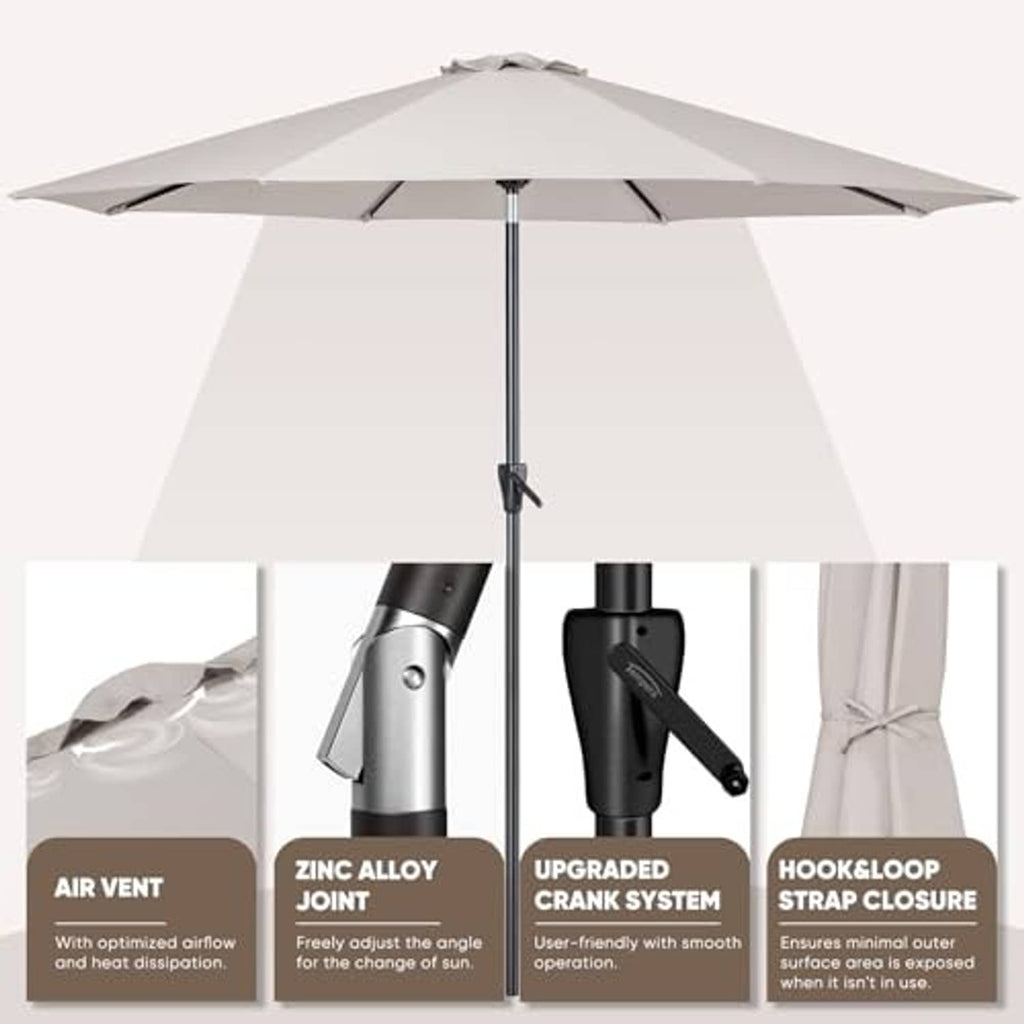 Beige patio umbrella with black crank mechanism and open canopy