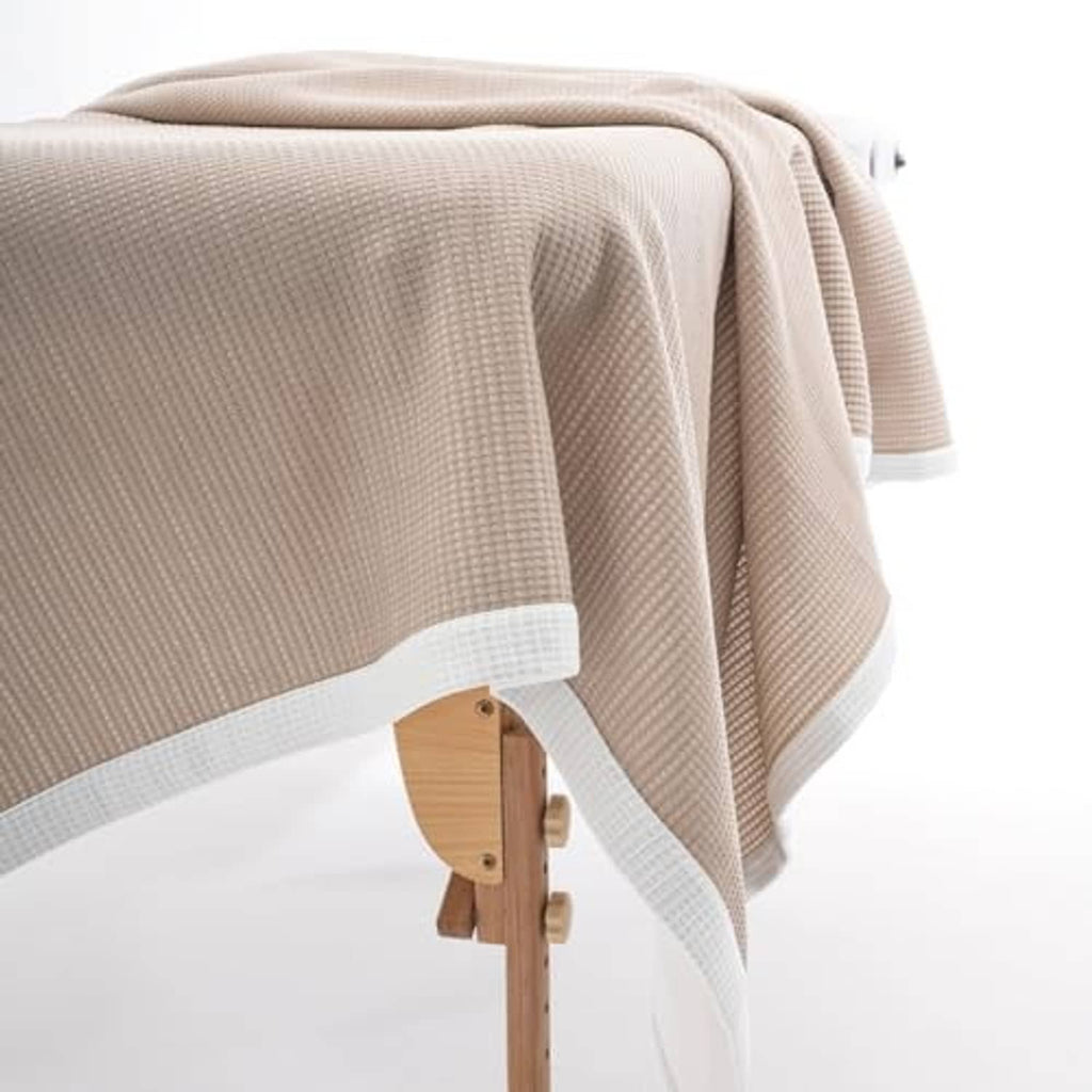 Soft microfiber double-sided blanket in khaki with white hem stripe, neatly draped.