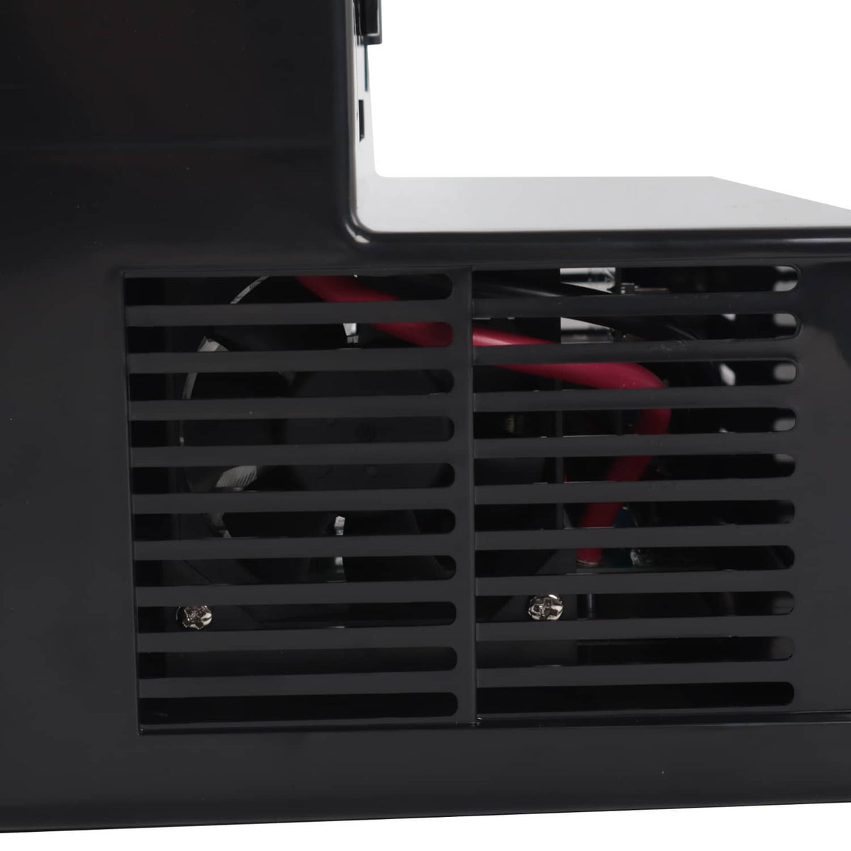 Ventilation grill and internal fan openings with visible wiring inside power converter