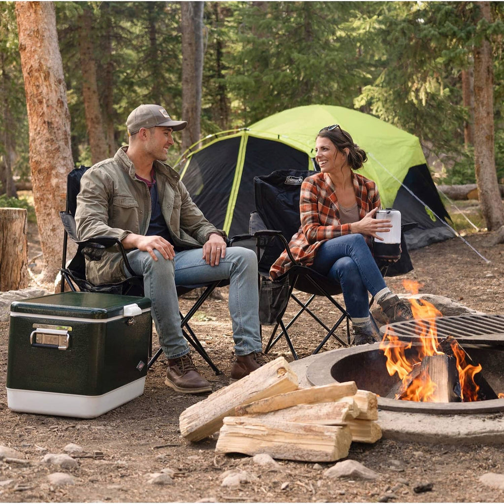 Coleman quad camp chair with built-in cooler and side storage, ready for camping