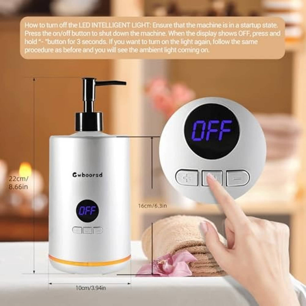 Oil warmer with OFF display and hand touching heating tray near towel