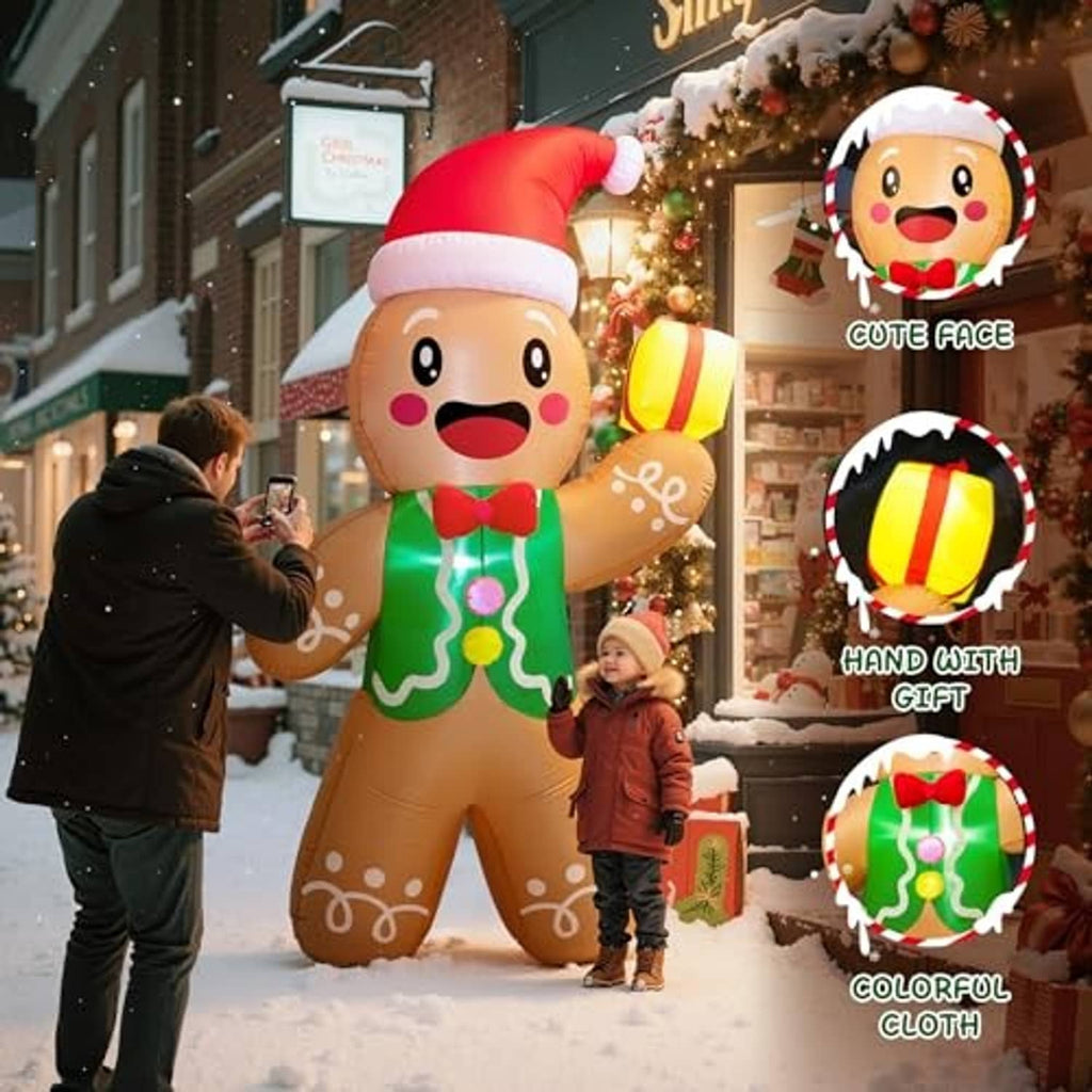 Gingerbread man inflatable with red Santa hat, green icing suit, holding a yellow gift box