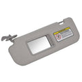 Grey left driver-side sun visor with built-in vanity mirror
