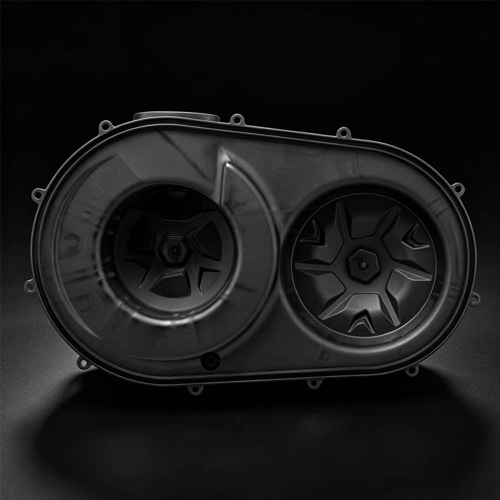 Dark outer clutch cover with two circular openings and star-pattern inserts