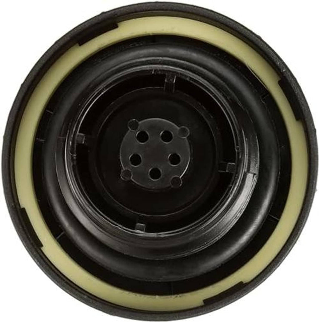 Fuel tank cap underside with circular ports and yellow rubber seal ring