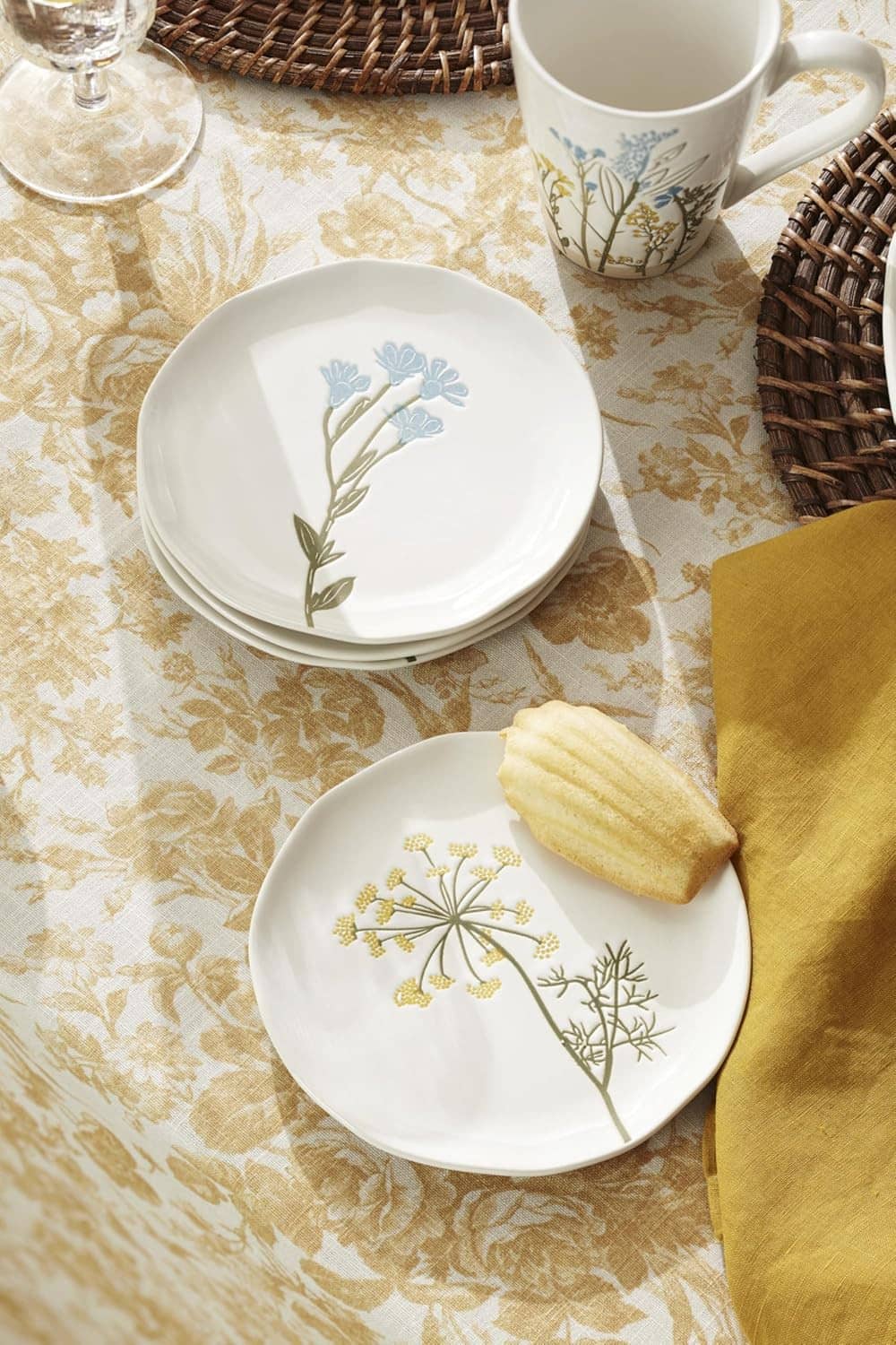 White tidbit plates with blue and gold wildflower stem illustrations