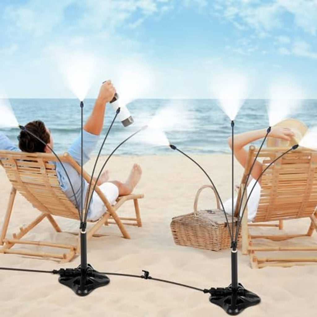 Two standing patio misting towers with flexible tubes and spray heads, portable set