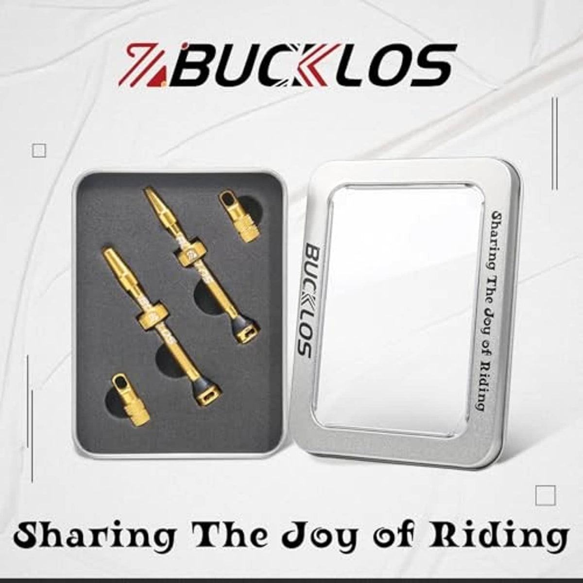 BUCKLOS valve stem kit in a metal case, with gold Presta stems and caps.