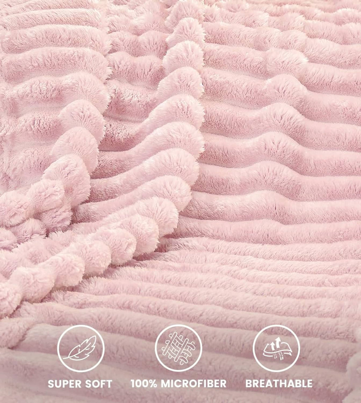 Pink plush fleece blanket with raised stripe texture, close-up