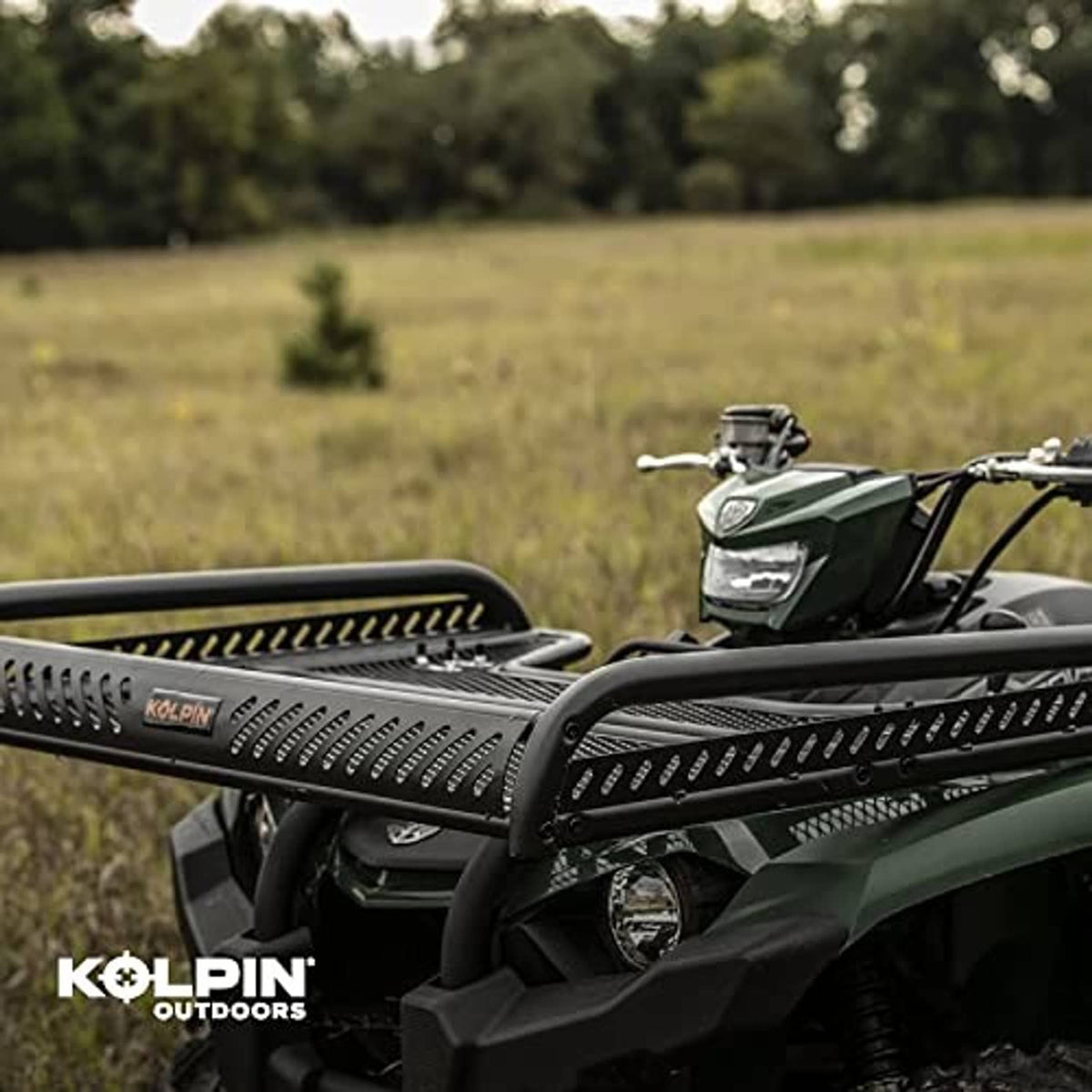 Black ATV flat rack with perforated mesh deck mounted at the front