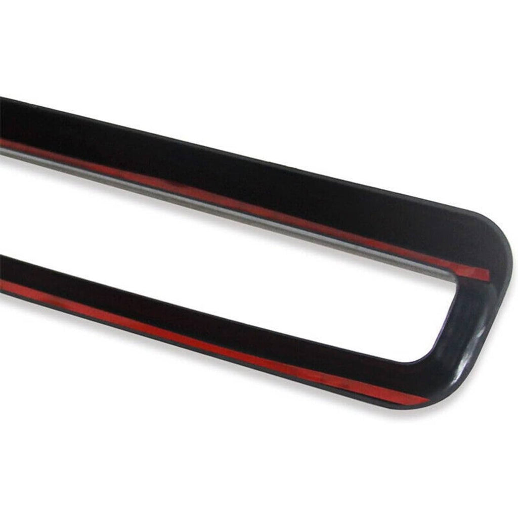 Black grille insert trim bar with red accent stripe along the rectangular opening
