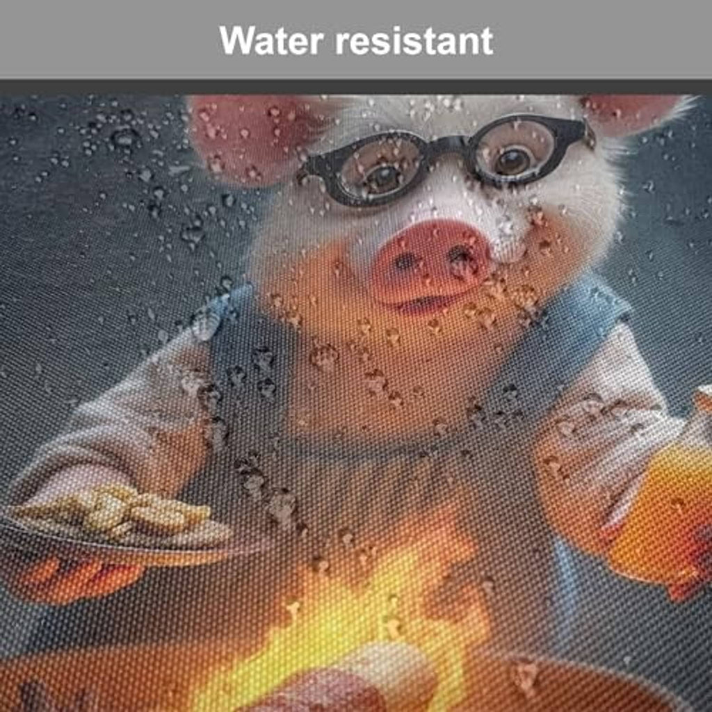 Water-resistant close-up of pig grilling print on dark blue apron with water droplets
