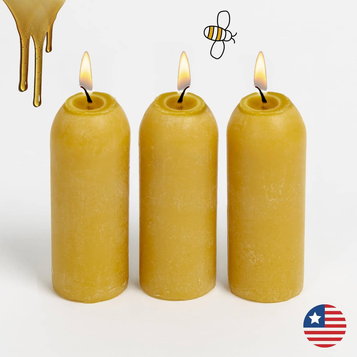 Three natural beeswax candles, yellow cylinders with visible wicks
