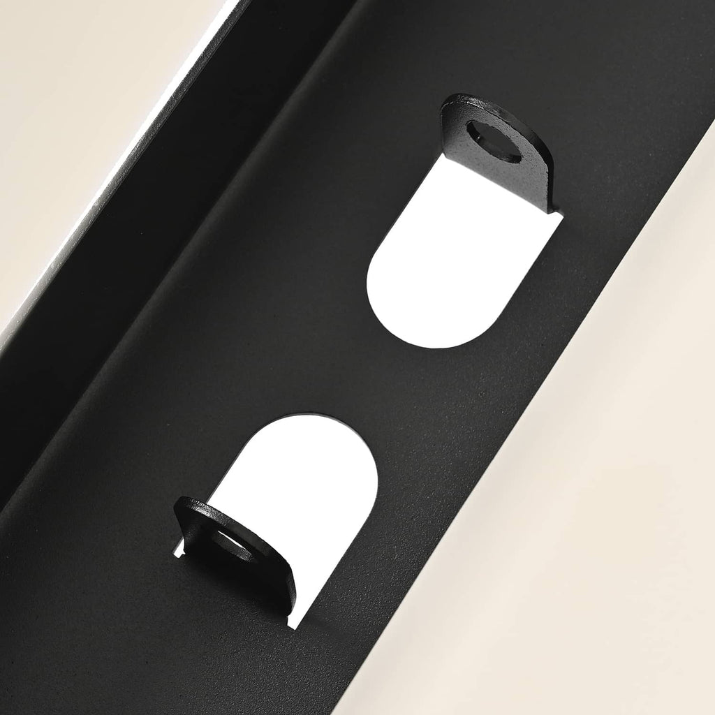 Black mounting plate close-up with holes and bracket tabs for seat installation