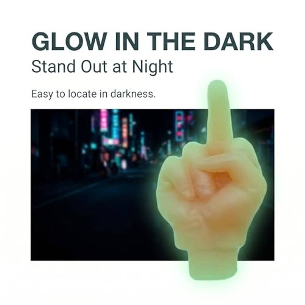 Glow-in-the-dark orange middle-finger valve stem cap with green light effect.