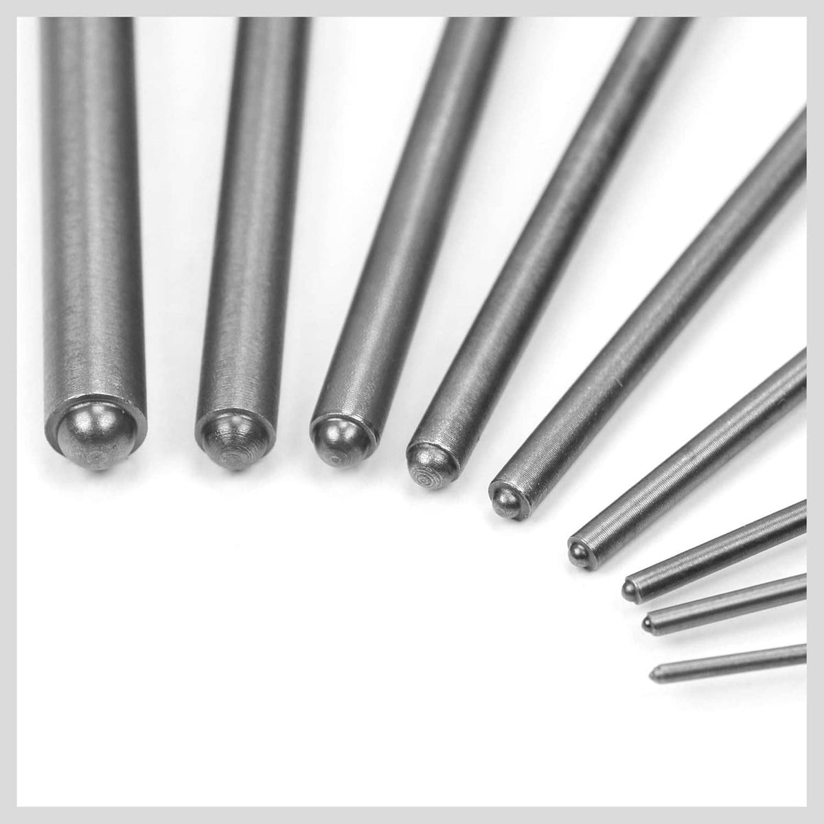 Steel roll pin punch tips with rounded ends, close-up of multiple punches