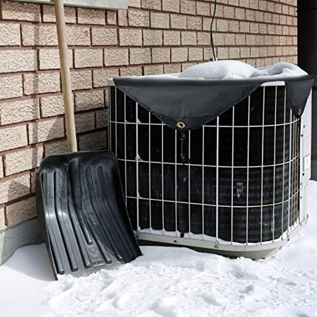 Black fitted outdoor AC cover on condenser unit, secured with bungee straps