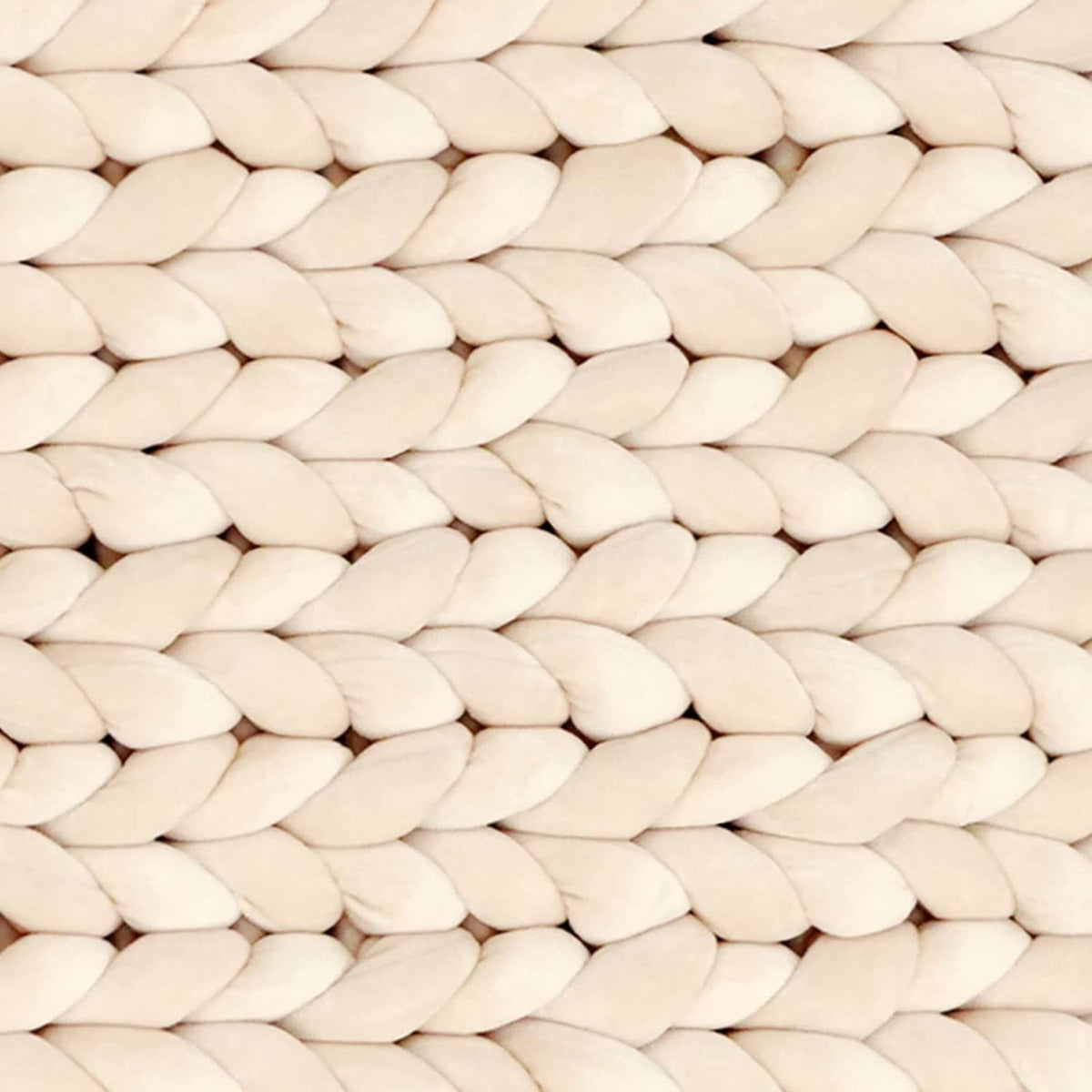 Beige chunky braided yarn strands in close-up texture.