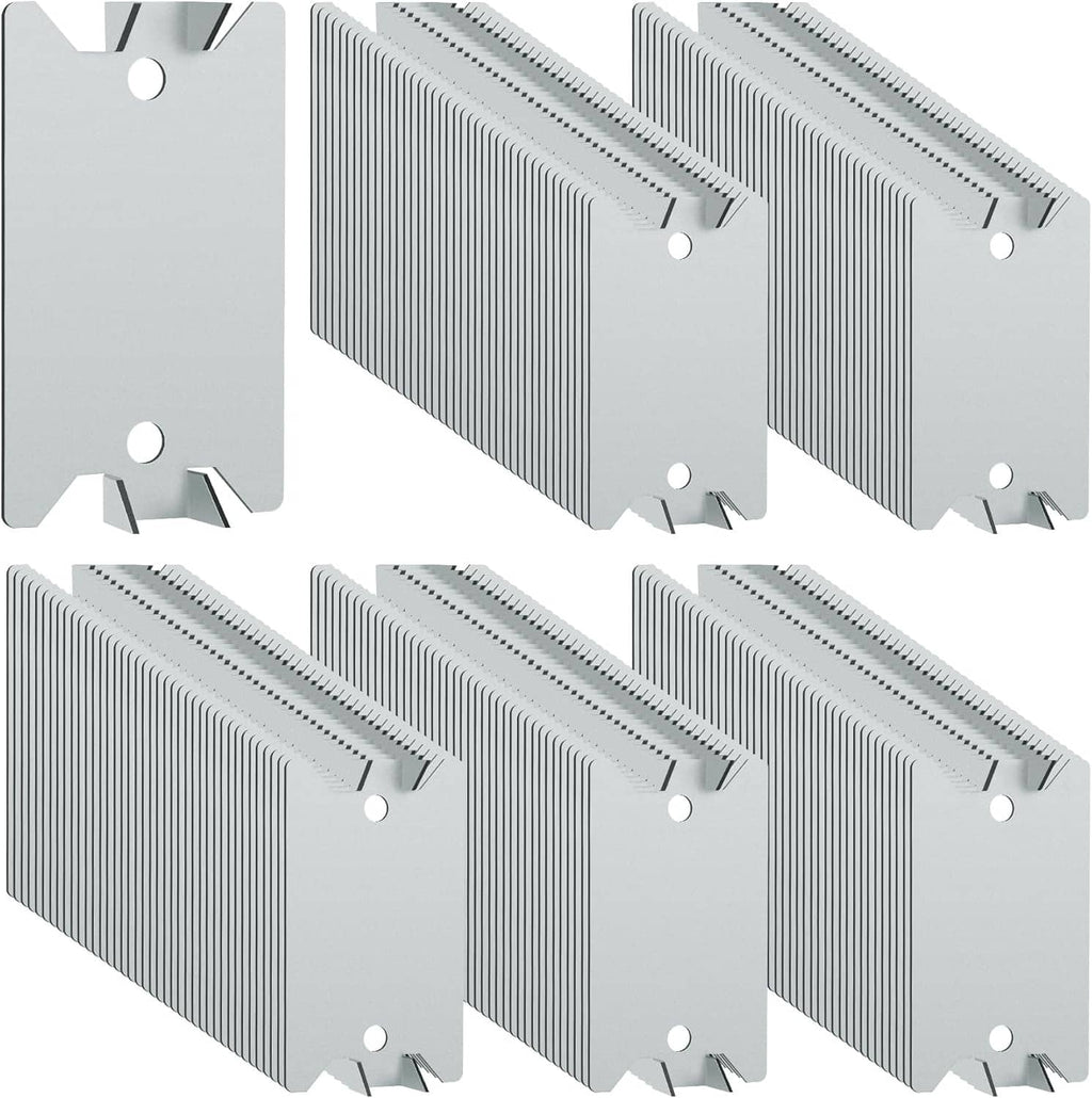 Set of metal nail stud guard plates with ridged sides, sharp prongs and mounting holes