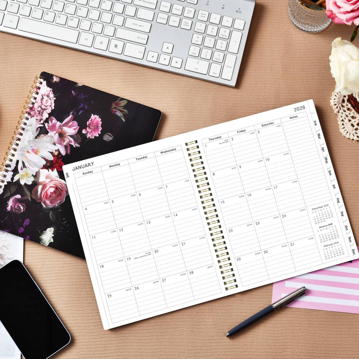 Open 2026 planner showing January monthly calendar and ruled weekly schedule pages
