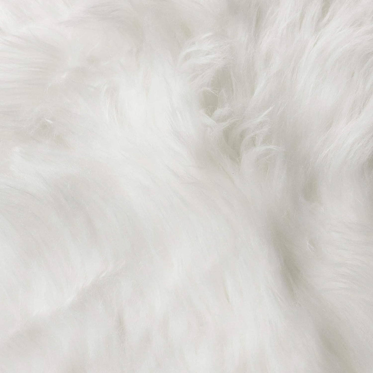 Close-up of white faux fur fibers, ultra-soft fluffy pile texture