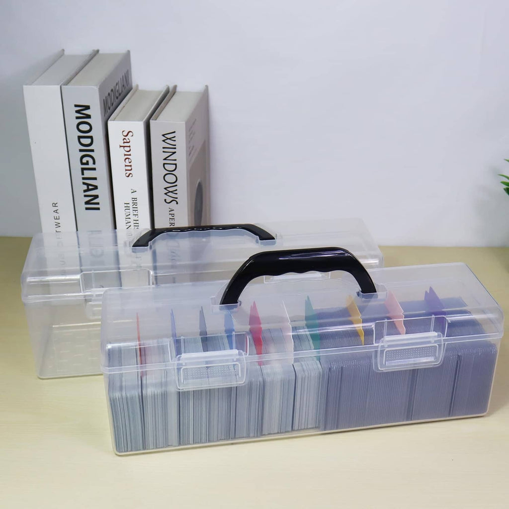 Clear plastic trading card storage box with handle and open lid, stacked top loaders