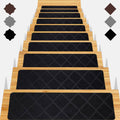 Black carpet stair treads with diamond pattern set on wooden steps