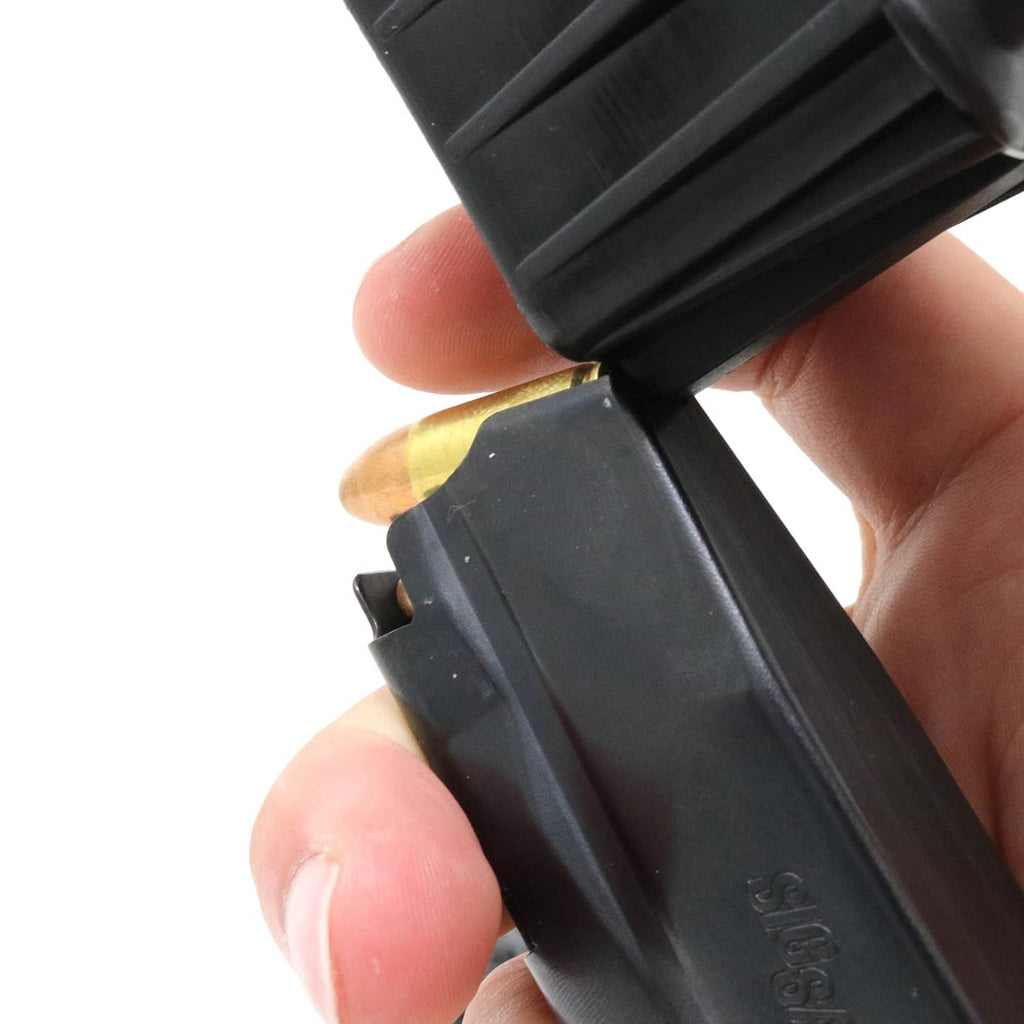 Brass round and black plastic speed loader base shown in close-up