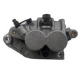 Front brake caliper, dark gray metal housing with mounting holes and hydraulic port