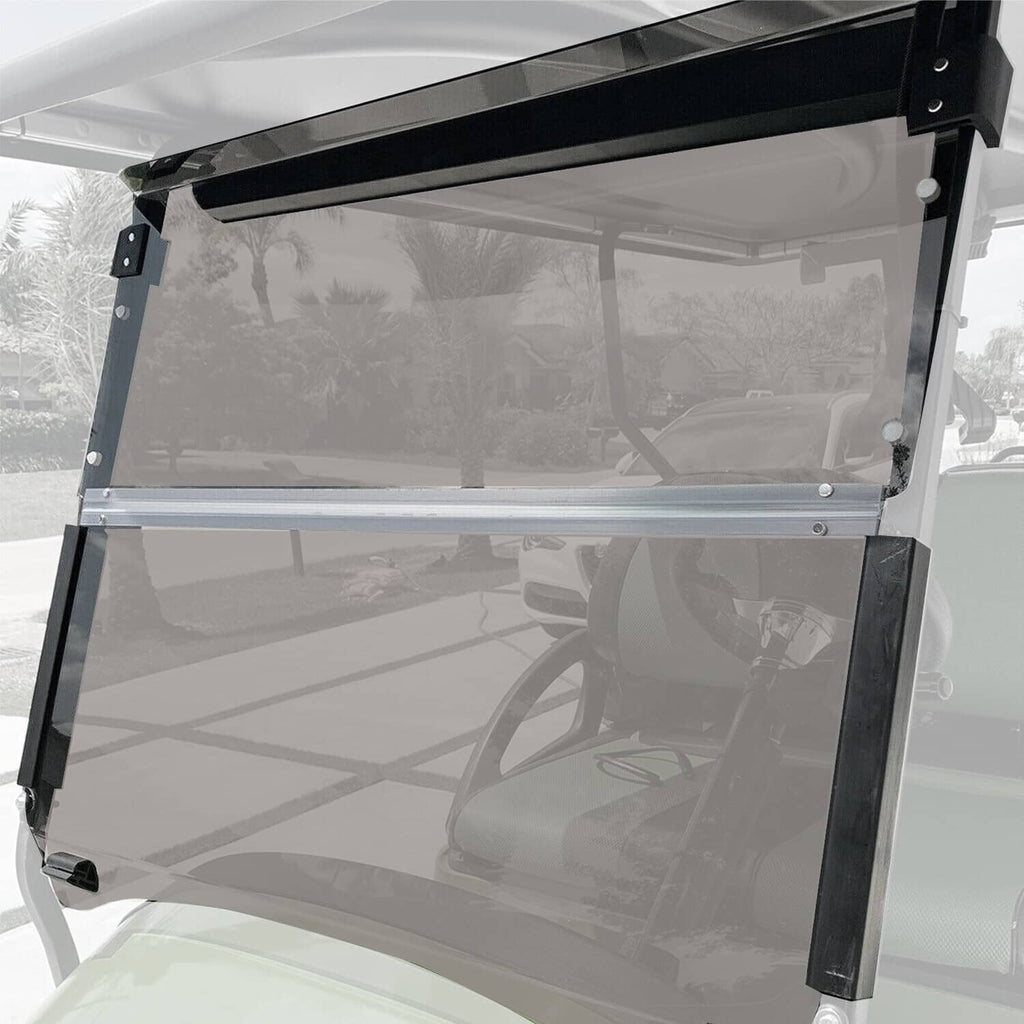 Fold-down tinted windshield with clear panel and black support frame on golf cart