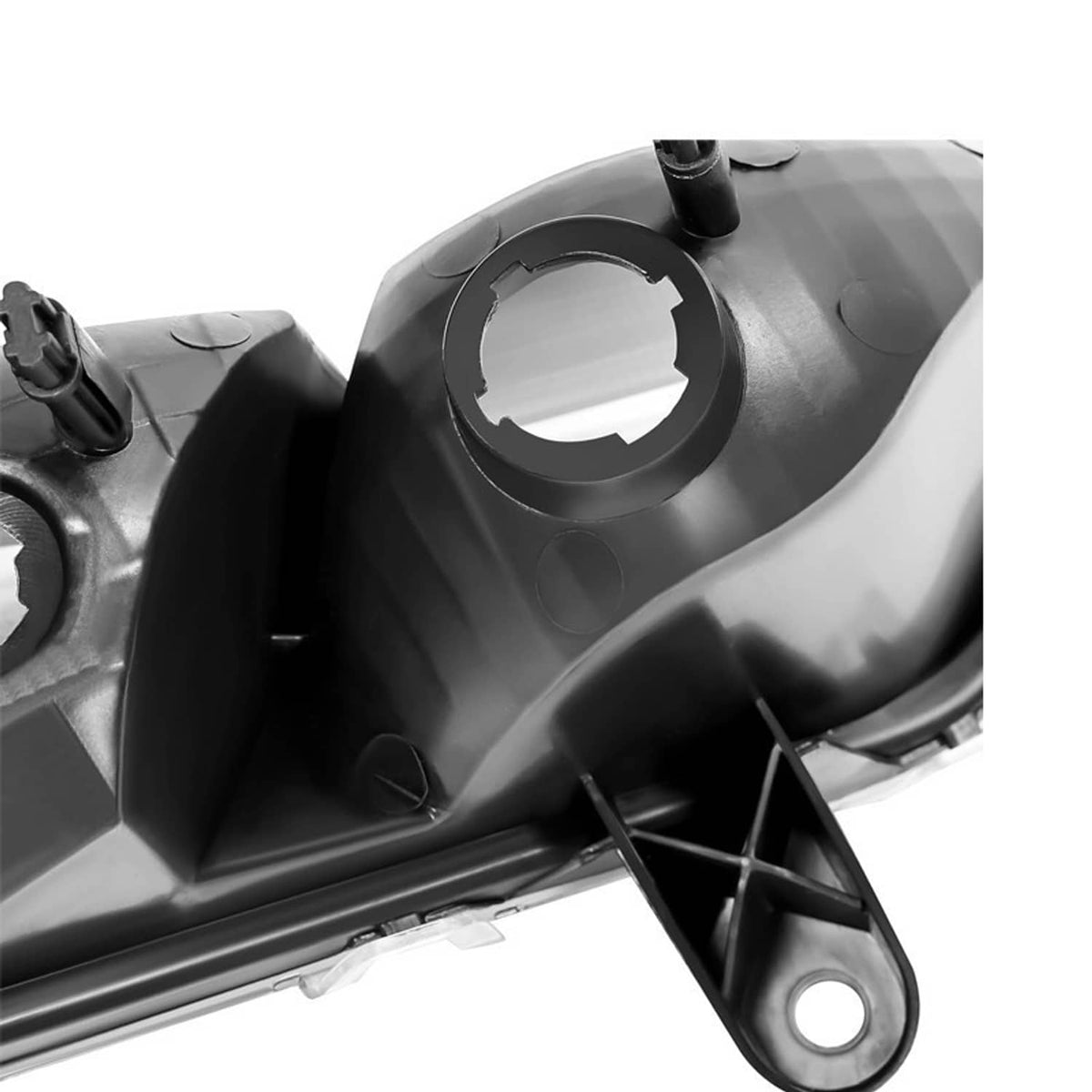 Driver-side LH fog light lamp housing detail, black bezel and circular mounting opening