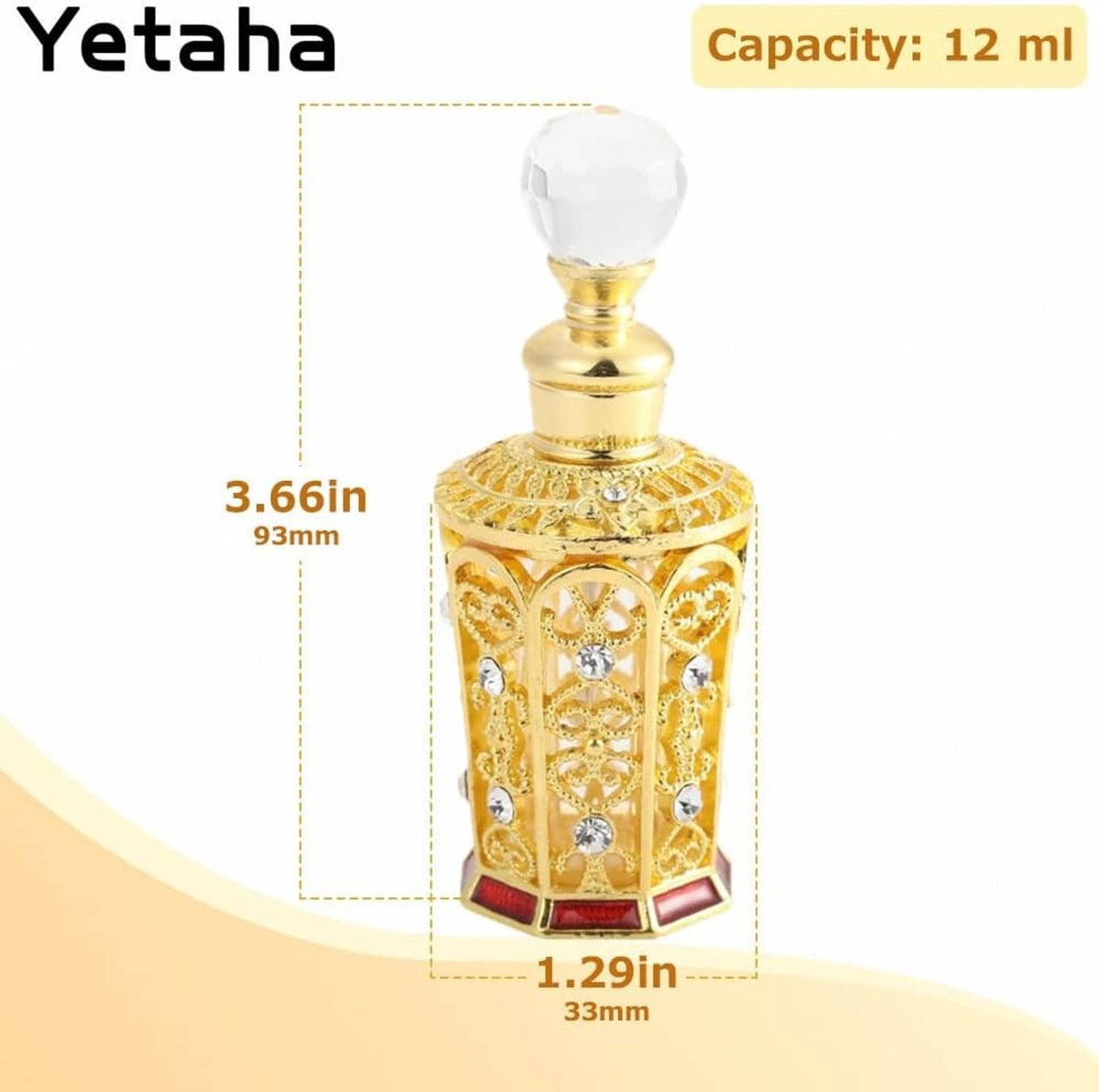 Golden ornate perfume bottle with clear faceted crystal cap, jeweled panels, red base
