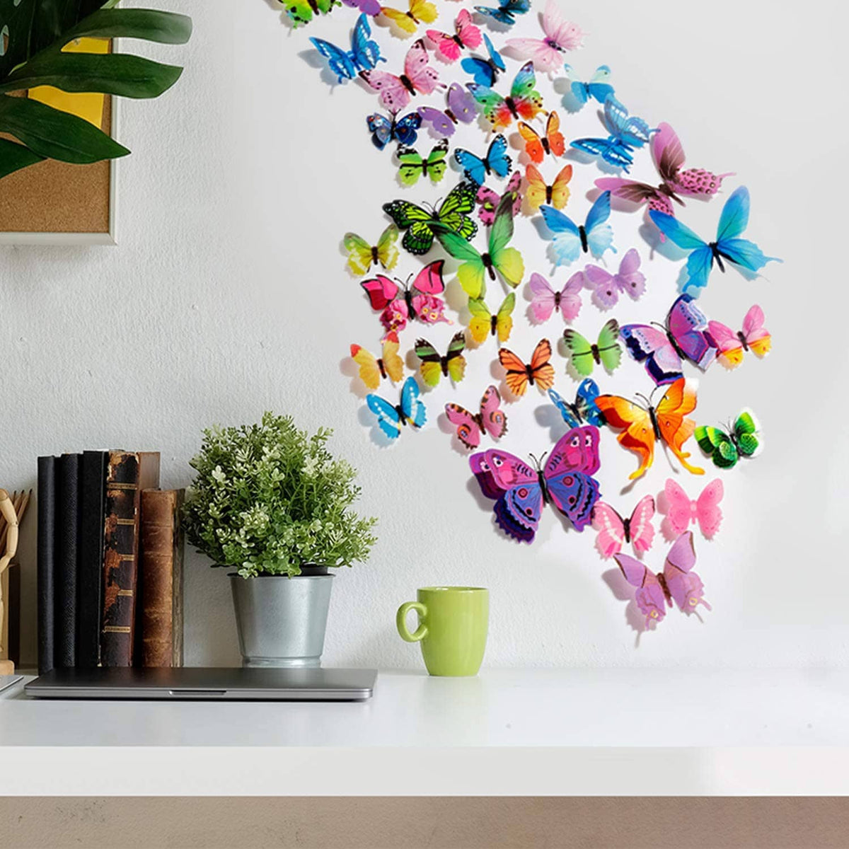 Cluster of multicolor butterfly wall stickers arranged on a white wall